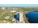 Aerial view of a condominium building, lake and surrounding area at 13427 Blue Heron Beach Dr # 1205, Orlando, FL 32821