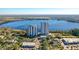 Expansive aerial view featuring condo buildings, lake, and surrounding community amenities at 13427 Blue Heron Beach Dr # 1205, Orlando, FL 32821