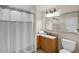 Bathroom featuring shower with tub, neutral walls, and modern sink with vanity and mirror at 13427 Blue Heron Beach Dr # 1205, Orlando, FL 32821