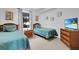 Twin bedroom with two twin-size beds and coastal decor at 13427 Blue Heron Beach Dr # 1205, Orlando, FL 32821