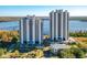Close aerial view of condo buildings with manicured landscaping and ample parking at 13427 Blue Heron Beach Dr # 1205, Orlando, FL 32821
