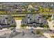 Beautiful aerial view of townhouses and the community with manicured landscaping and palm trees at 13429 Fountainbleau Dr # 13429, Clermont, FL 34711