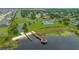 Aerial view of the boat dock and ramp, tennis court and community neighborhood by the lake at 13429 Fountainbleau Dr # 13429, Clermont, FL 34711