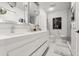 Bright bathroom offers dual sinks, modern fixtures, and a stylish, minimalist design at 13429 Fountainbleau Dr # 13429, Clermont, FL 34711