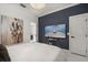 Chic bedroom features a TV, modern decor, and bright natural light at 13429 Fountainbleau Dr # 13429, Clermont, FL 34711