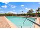 Community pool with sundeck and clear blue water at 13429 Fountainbleau Dr # 13429, Clermont, FL 34711