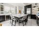Stylish kitchen with a center island, seating, modern appliances, and plenty of natural light at 13429 Fountainbleau Dr # 13429, Clermont, FL 34711