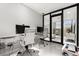 Home office featuring modern desks, white chairs, and plenty of natural light at 13429 Fountainbleau Dr # 13429, Clermont, FL 34711