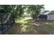 Lush backyard view featuring mature trees and a pond, providing a tranquil and private outdoor space at 13520 Meadow Bay Loop, Orlando, FL 32824