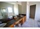 Bright bathroom features a dual sink vanity with granite countertops, soaking tub, and tiled floor at 13520 Meadow Bay Loop, Orlando, FL 32824