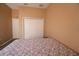 This bedroom features wood floors, a closet, and neutral-colored walls at 13520 Meadow Bay Loop, Orlando, FL 32824