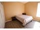 This bedroom features wood floors, a closet, and neutral-colored walls at 13520 Meadow Bay Loop, Orlando, FL 32824