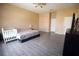 Spacious bedroom with wood-look floors, ceiling fan, neutral paint color, and a large closet at 13520 Meadow Bay Loop, Orlando, FL 32824