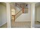 Bright foyer with wood and white staircase and views to the living room at 13520 Meadow Bay Loop, Orlando, FL 32824