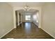 Open-concept living room with wood floors and view into the entry foyer at 13520 Meadow Bay Loop, Orlando, FL 32824