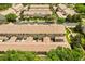 A sunny aerial view of townhomes that shows the community layout at 1530 Tally Cir, Oviedo, FL 32765