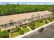 Aerial view of townhomes with sidewalks, green spaces, and parking at 1530 Tally Cir, Oviedo, FL 32765
