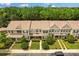 Aerial view of townhomes featuring well-maintained landscaping and mature trees at 1530 Tally Cir, Oviedo, FL 32765