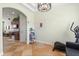 Bright bonus room with exercise equipment and decor, featuring tile flooring and a view into the kitchen at 1530 Tally Cir, Oviedo, FL 32765