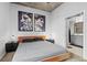 Modern bedroom with artwork and ensuite bathroom at 155 S Court Ave # 1202, Orlando, FL 32801