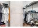 Well-organized walk-in closet with shelving and clothing racks for ample storage at 155 S Court Ave # 1202, Orlando, FL 32801