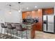 Contemporary kitchen features stainless appliances, sleek cabinetry, and bar seating at 155 S Court Ave # 1202, Orlando, FL 32801