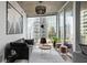 Well-lit living room featuring minimalist decor and city views at 155 S Court Ave # 1202, Orlando, FL 32801