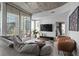 Spacious living area with plush seating, balcony access, and city view at 155 S Court Ave # 1202, Orlando, FL 32801