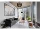 Sleek living room boasts floor to ceiling windows with city views and minimalist decor at 155 S Court Ave # 1202, Orlando, FL 32801