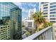 Beautiful downtown view from the balcony with palm trees and office buildings at 155 S Court Ave # 1202, Orlando, FL 32801