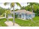 Beautiful home with well-manicured lawn, mature landscaping, and a stone walkway at 157 Long Pine Dr, Deltona, FL 32725