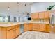 Spacious kitchen with stainless steel appliances, ample counter space, and a convenient beverage fridge at 157 Long Pine Dr, Deltona, FL 32725