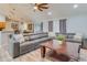 Comfortable living room with a large sectional sofa and access to the dining area and kitchen at 157 Long Pine Dr, Deltona, FL 32725