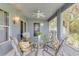 Relaxing screened-in porch featuring stylish outdoor seating, and ceiling fan at 157 Long Pine Dr, Deltona, FL 32725