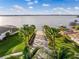 Aerial view of a boat ramp leading to a lake surrounded by homes and lush greenery at 200 Valencia Ridge Dr, Auburndale, FL 33823