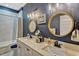 Elegant bathroom with double sinks, granite countertops, and modern fixtures, offering a blend of style and functionality at 200 Valencia Ridge Dr, Auburndale, FL 33823