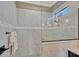Luxurious walk-in shower featuring stylish tile work, glass enclosure, and modern fixtures at 200 Valencia Ridge Dr, Auburndale, FL 33823