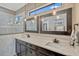 Elegant bathroom with dual vanity, decorative mirrors, and modern lighting at 200 Valencia Ridge Dr, Auburndale, FL 33823