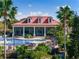 Poolside at community clubhouse offering covered seating, a luxurious pool, and well-maintained landscaping at 200 Valencia Ridge Dr, Auburndale, FL 33823