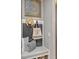 Charming entryway bench seating with decorative pillows and storage cubbies below at 200 Valencia Ridge Dr, Auburndale, FL 33823