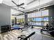 Bright gym with modern equipment, fitness machines, and a mirror wall for a full workout experience at 200 Valencia Ridge Dr, Auburndale, FL 33823