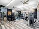 Modern gym featuring fitness equipment, ceiling fans, and a mirror wall at 200 Valencia Ridge Dr, Auburndale, FL 33823