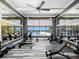 Spacious gym featuring fitness equipment, ceiling fans, a mirror wall and serene outdoor views at 200 Valencia Ridge Dr, Auburndale, FL 33823