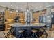Spacious kitchen with a large island, granite countertops, wooden cabinets and stainless steel appliances at 200 Valencia Ridge Dr, Auburndale, FL 33823