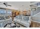 Open-concept living room with a cozy sofa, adjacent dining area, and a kitchen at 200 Valencia Ridge Dr, Auburndale, FL 33823