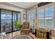 Cozy living area with water views, plantation shutters, and a decorative trunk at 200 Valencia Ridge Dr, Auburndale, FL 33823