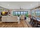 Bright living room with large sliding glass doors, comfortable seating and waterfront views at 200 Valencia Ridge Dr, Auburndale, FL 33823