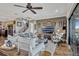 Spacious living room featuring a ceiling fan, staircase and lots of natural light at 200 Valencia Ridge Dr, Auburndale, FL 33823