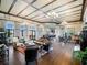 A wide-angle view of a spacious lounge with multiple seating areas and stylish decor at 200 Valencia Ridge Dr, Auburndale, FL 33823
