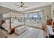 Bedroom featuring a canopy bed, a bay window with a water view, and natural light at 200 Valencia Ridge Dr, Auburndale, FL 33823